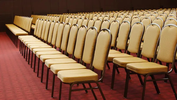 Empty chairs in conference hall