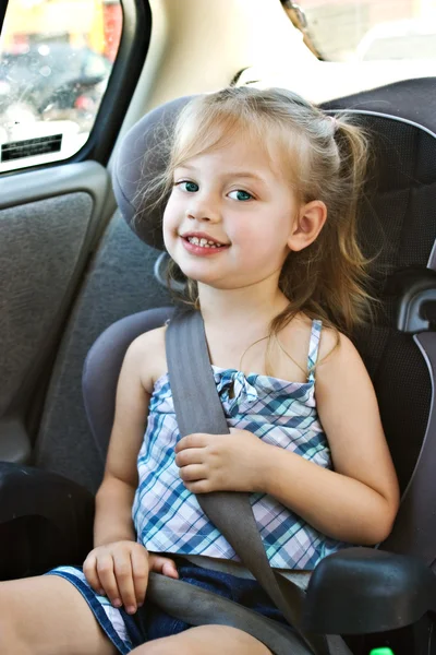 Little girl in a car seat