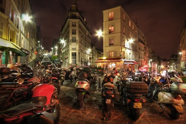 Motorbikes parked on a city street