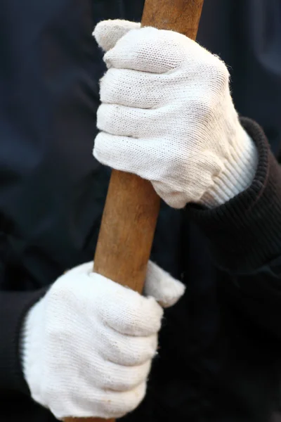 Human hands in white garden cotton glove