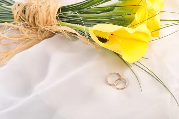 Flowers and wedding rings by Denis Tabler Stock Photo