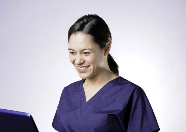Smiling asian medical assistant.