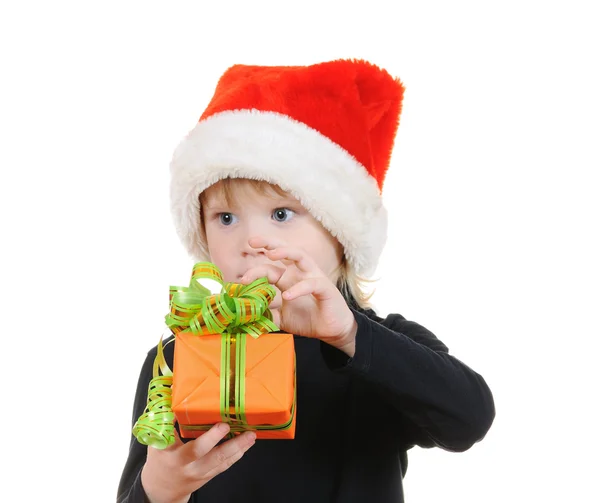 A criança em um chapéu Papai Noel — Fotografia de Stock
