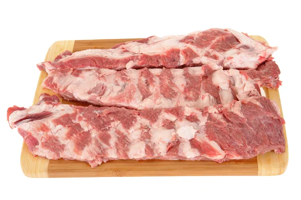 Vlees op een snijplank — Stockfoto