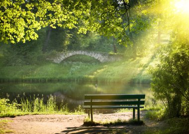 a bench in the park at sunset  clipart