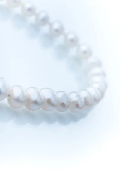 stock image pearl necklace on a white background 