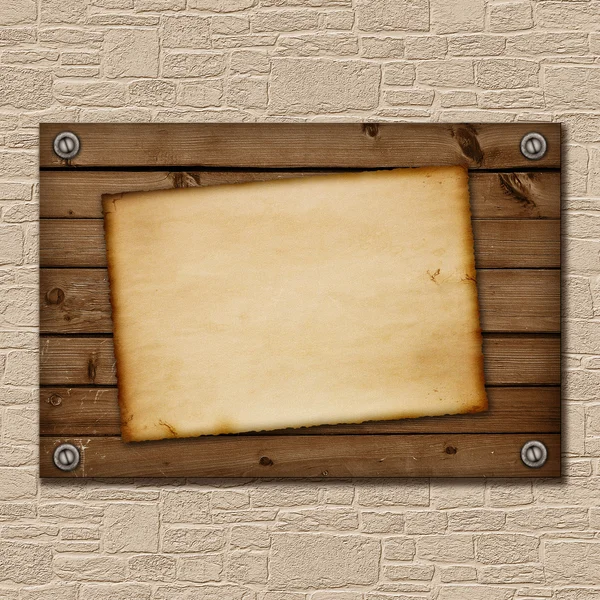 Old piece of paper on a wooden board — Stock Photo, Image