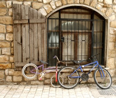 Old bikes in old street... clipart