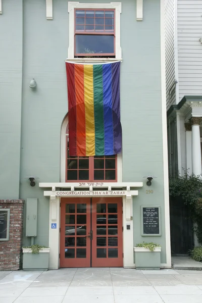 stock image Rainbow flag on Synagogue in San Francisco Castro district.
