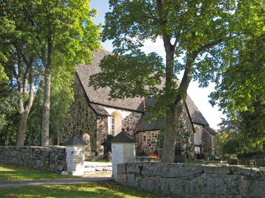 Sunny day near the old church clipart