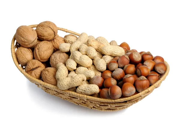 Set of nuts in a wicker basket — Stock Photo, Image