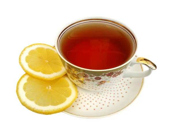 Filiżankę herbaty i plasterki cytryny — Zdjęcie stockowe