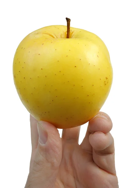 Жовте яблуко в руці — стокове фото