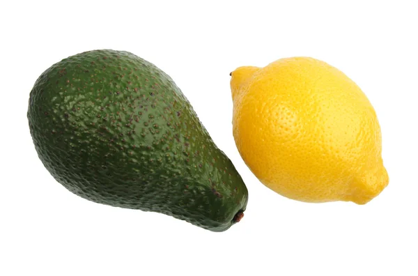 Green avocado and yellow lemon. — Stock Photo, Image