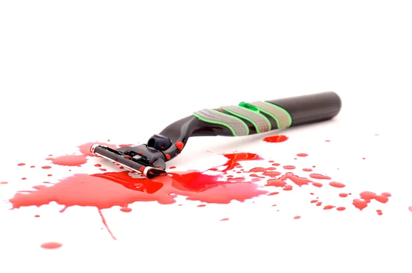 Sharp razor with the splashes of blood . — Stock Photo, Image