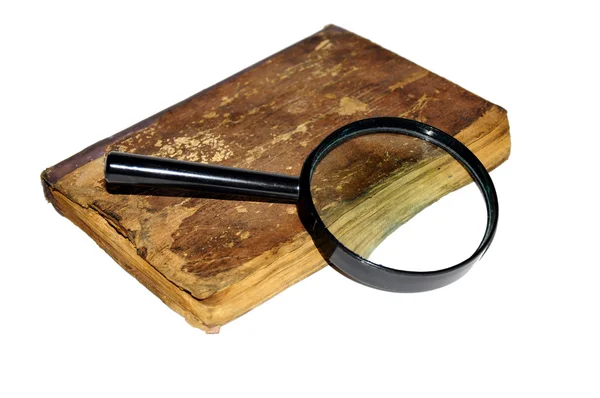 Book and glass loupe — Stock Photo, Image