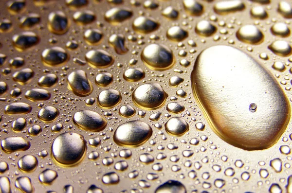 Water gold drops — Stock Photo, Image