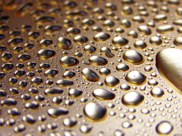 Water gold drops — Stock Photo, Image