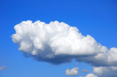 White fluffy clouds in the blue sky clipart