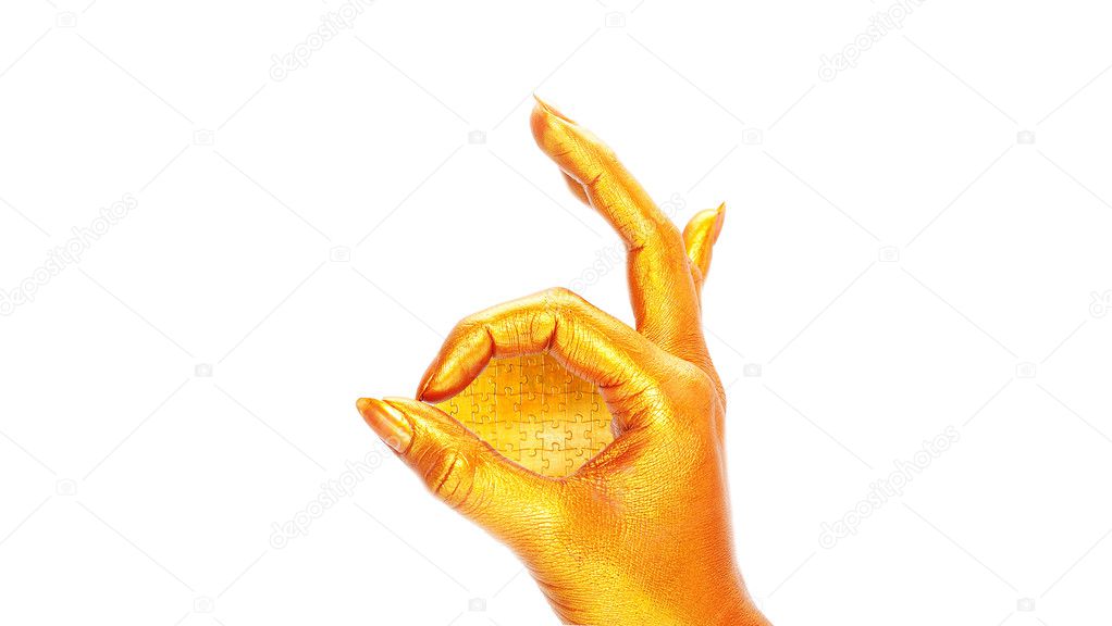 Gold hand with puzzles
