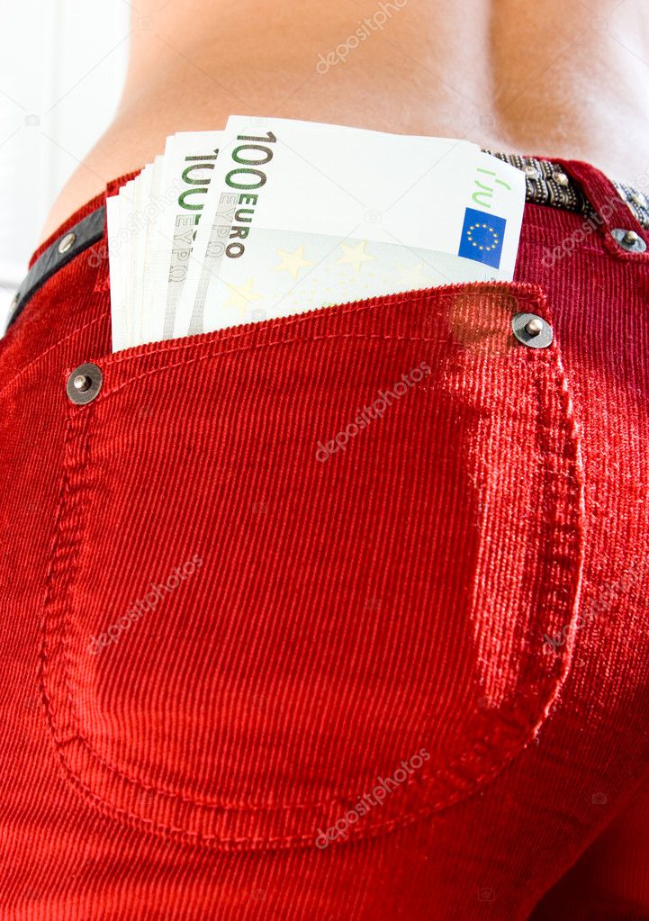 euro banknotes in jeans pocket 
