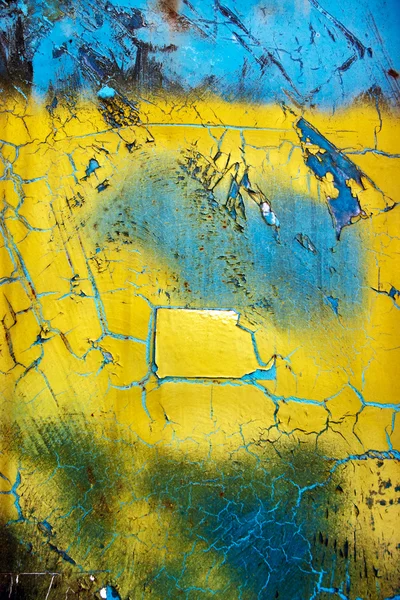 Verwitterte blaue und gelbe Oberfläche — Stockfoto