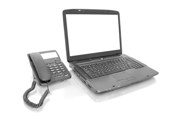 Laptop com telefone — Fotografia de Stock