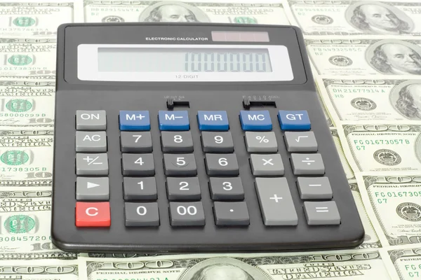 Калькулятор с деньгами — стоковое фото