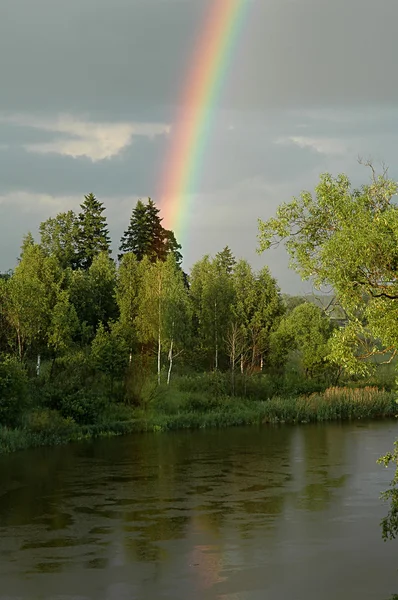 Rainbow above the river. — Stock Photo, Image