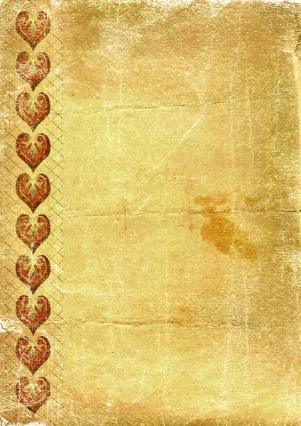 Παλιό κίτρινο χαρτί με καρδιές — Φωτογραφία Αρχείου