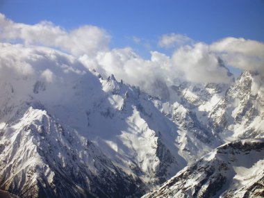 Mountains in clouds. clipart