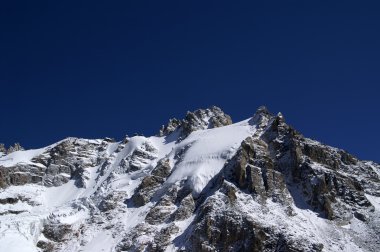 Mountains covered with snow and ice clipart