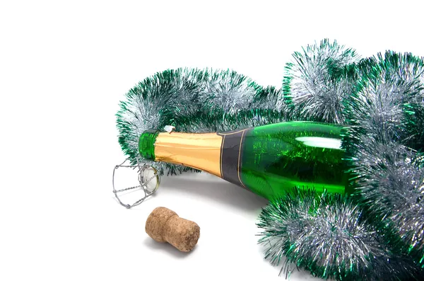 Botella de champagne y oropel — Foto de Stock