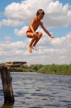 little girl jumping on a pier  clipart