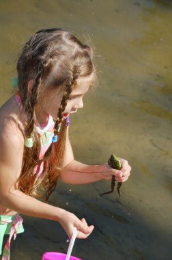 girl in pink dress playing with water  clipart