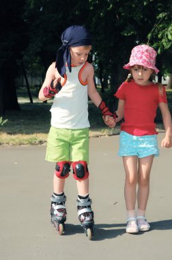 young boy with skating  clipart