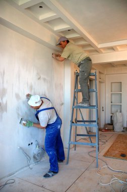 worker repairing the wall  clipart