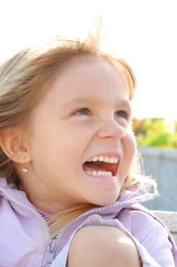 portrait of happy child on nature in summer  clipart