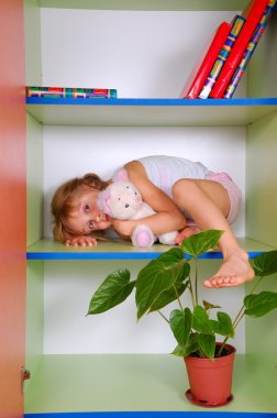 cute girl on the shelves of the plants  clipart