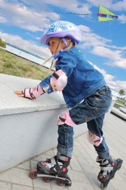 little girl on roller skates  clipart