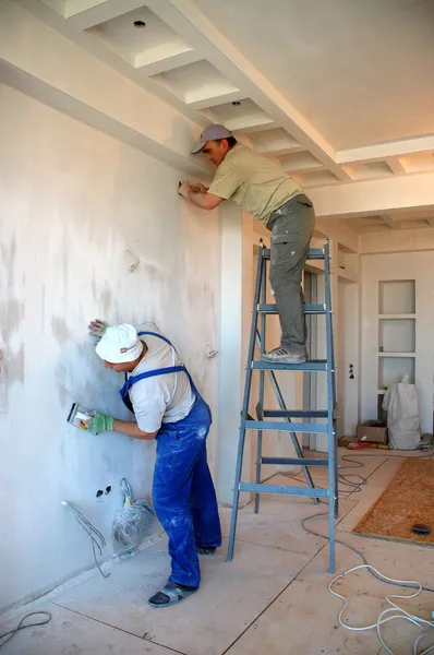 Worker Repairing Wall — Photo