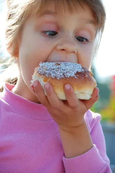 Child Eating Donut — Stok fotoğraf