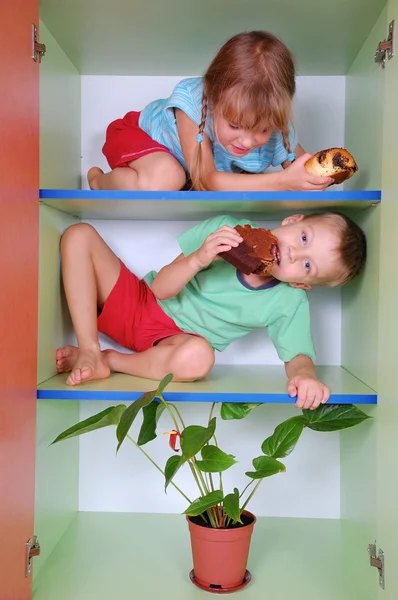 stock image two boys are playing with a wooden shelf 