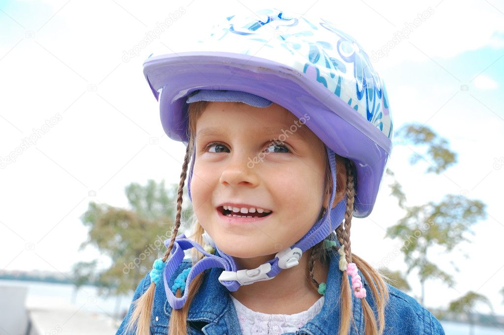 little girl with bicycle on background 