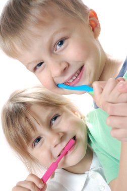 Children cleaning teeth clipart