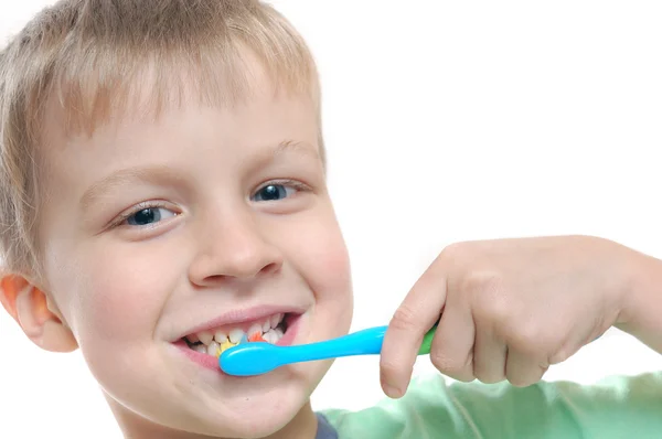 Kid cleaning teeth — Stock Photo, Image