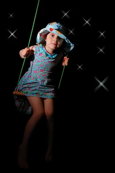 Swinging girl — Stockfoto