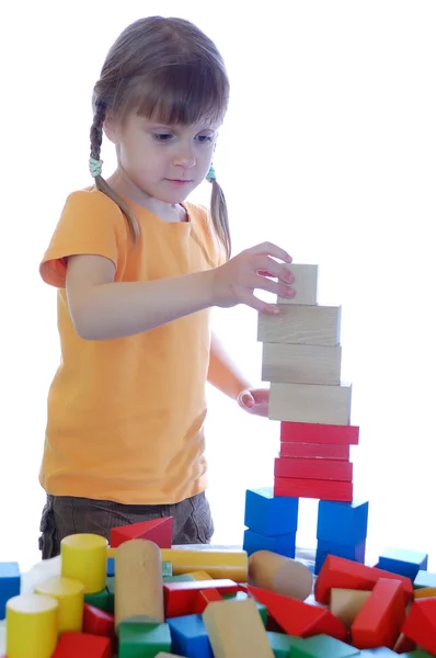 Kid playing with bricks Stock Photo