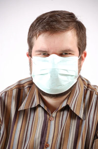 Man wearing a surgical mask — Stock Photo, Image