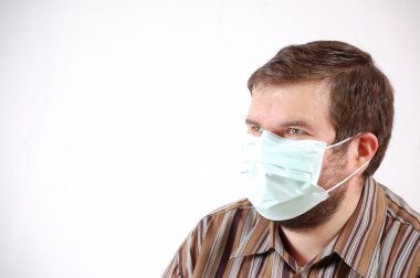 Man wearing a surgical mask clipart